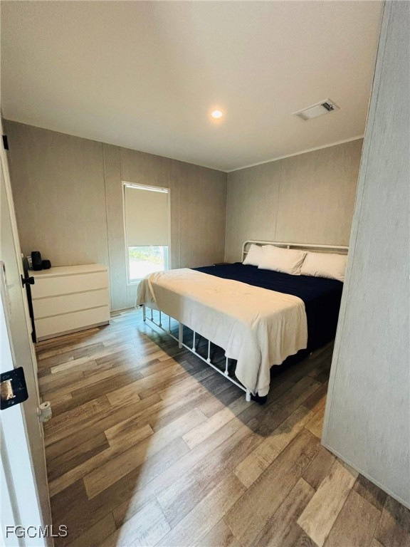 545 South Estribo Street Clewiston, FL 33440 - Photo 8 of 13 a bedroom with a bed and window