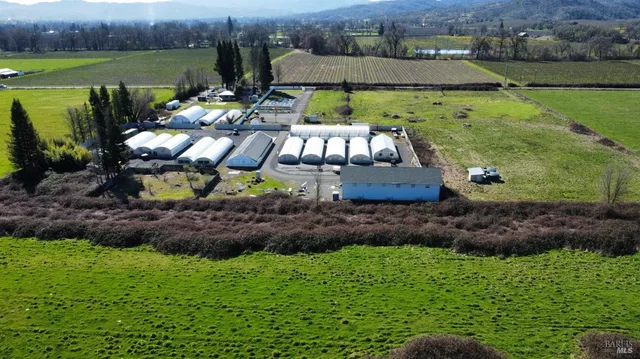 an aerial view of a house with outdoor space
