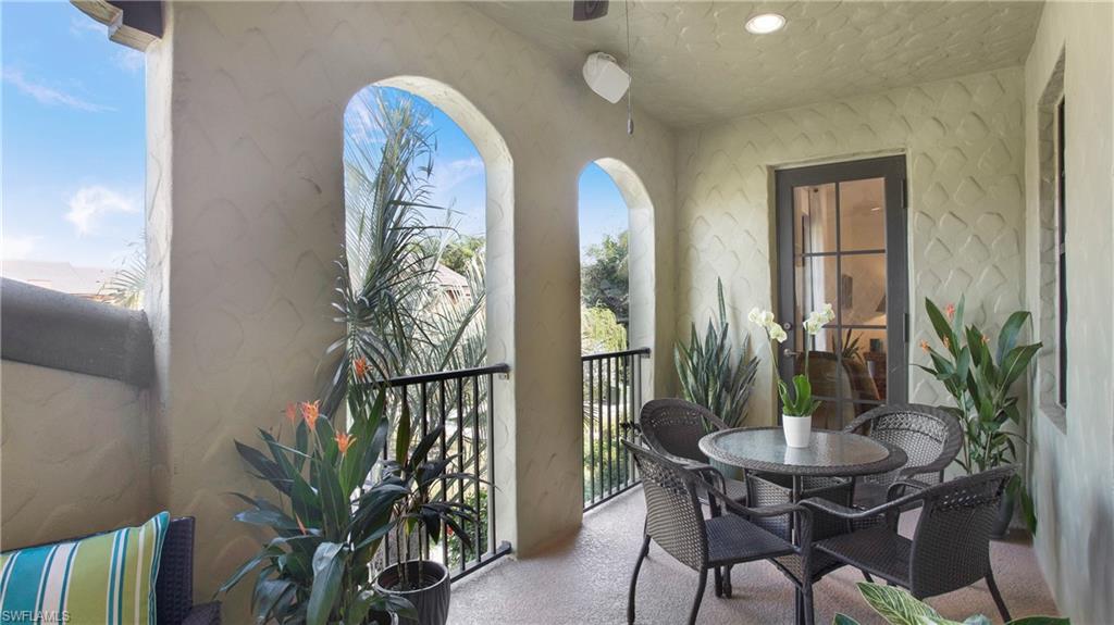 9078 Albion Lane South, Unit 6603 Naples, FL 34113 - Photo 13 of 41 a view of a dining room with furniture and wooden floor