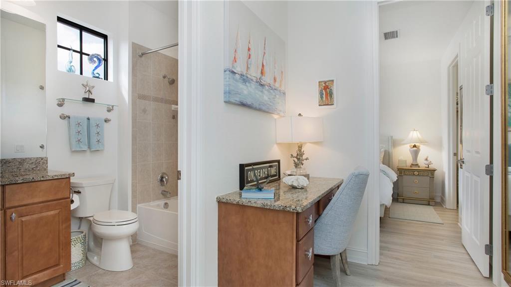 9078 Albion Lane South, Unit 6603 Naples, FL 34113 - Photo 15 of 41 a room with a table and chairs