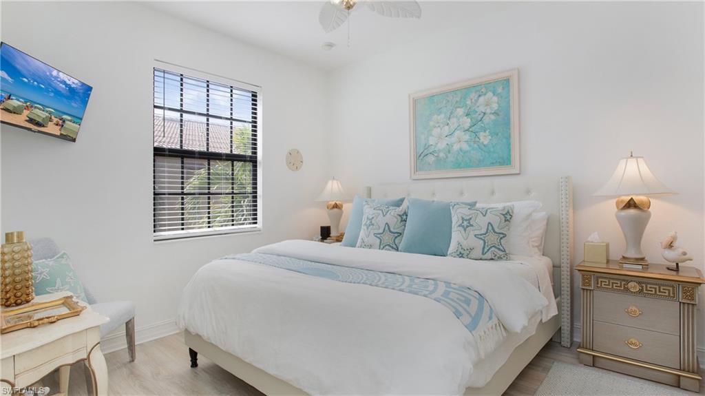 9078 Albion Lane South, Unit 6603 Naples, FL 34113 - Photo 22 of 41 a bedroom with a bed and a window