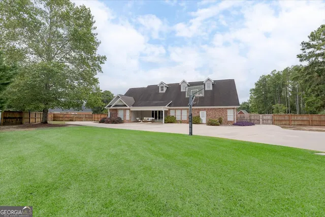 a view of a room with wooden floor and a window