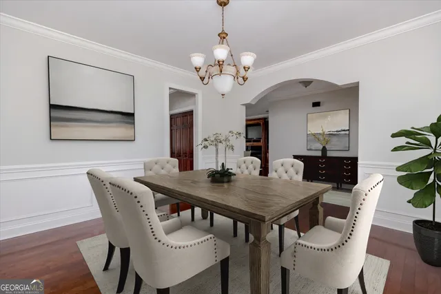 a living room with furniture flat screen tv and a large window