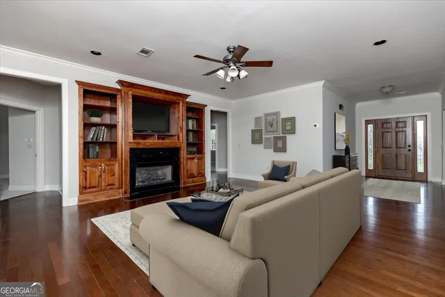 a kitchen with refrigerator cabinets and wooden floor