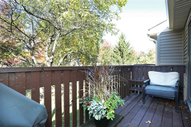 a balcony with wooden floor
