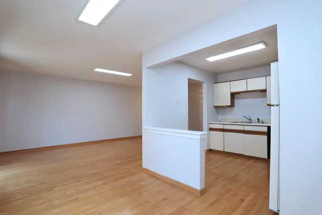 a kitchen with granite countertop a stove and a refrigerator