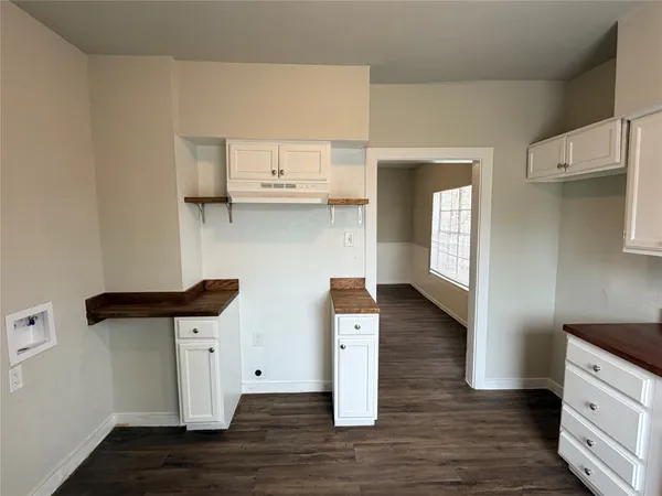 a view of kitchen and wooden floor