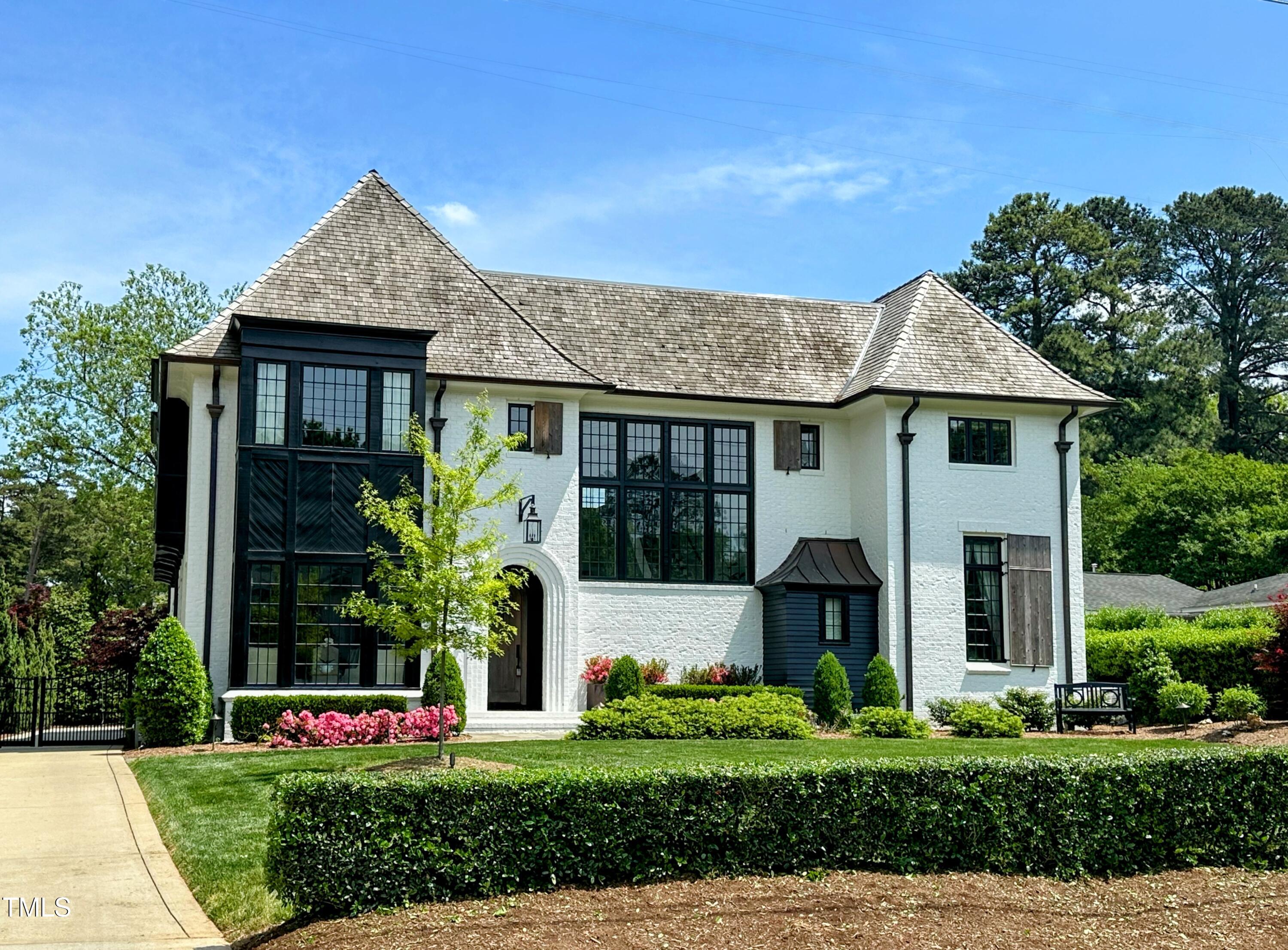 1324 Brooks Avenue Raleigh, NC 27607 - Photo 1 of 65 a front view of a house with garden