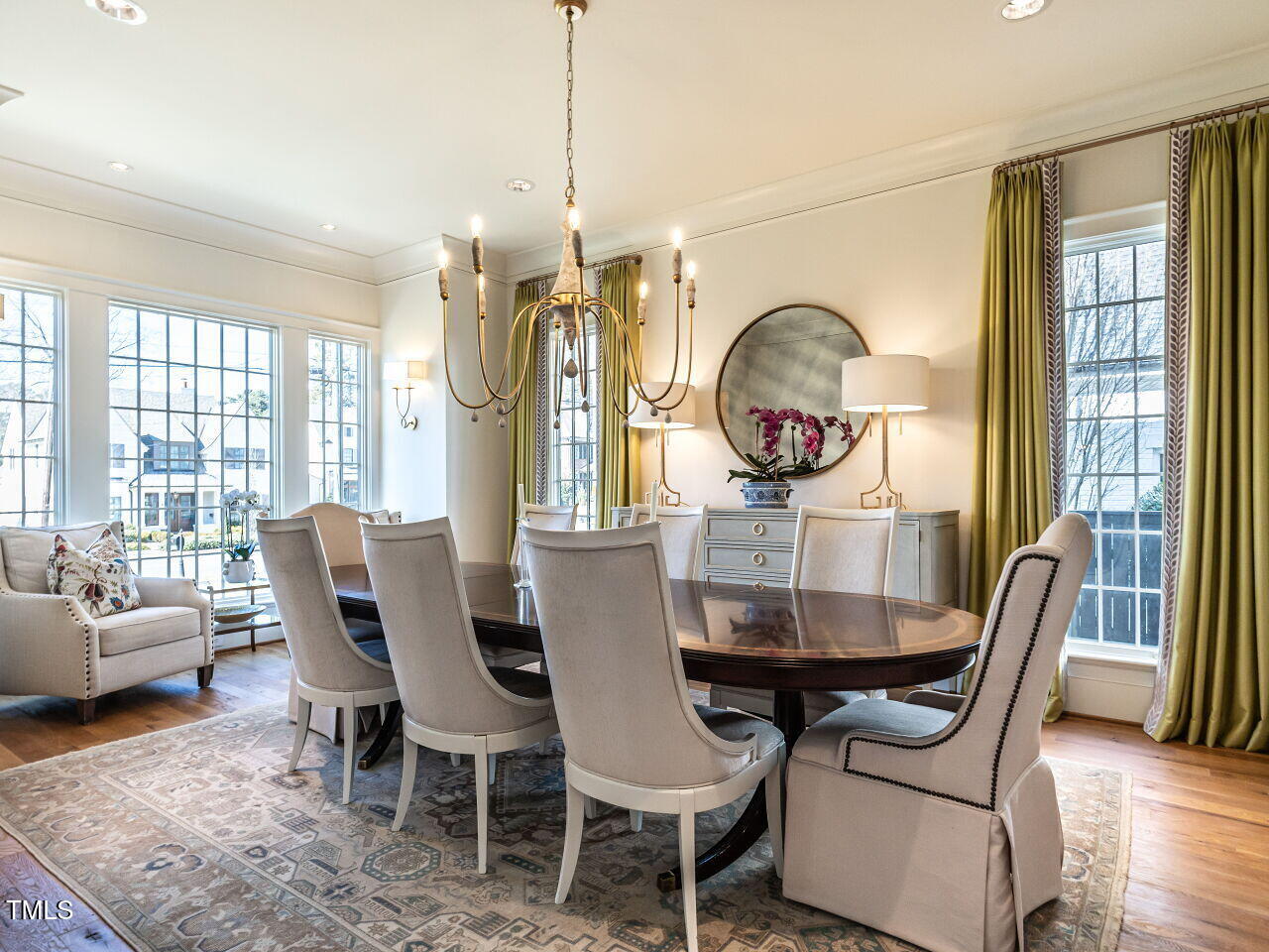 1324 Brooks Avenue Raleigh, NC 27607 - Photo 8 of 65 a view of a dining room with furniture wooden floor and a chandelier