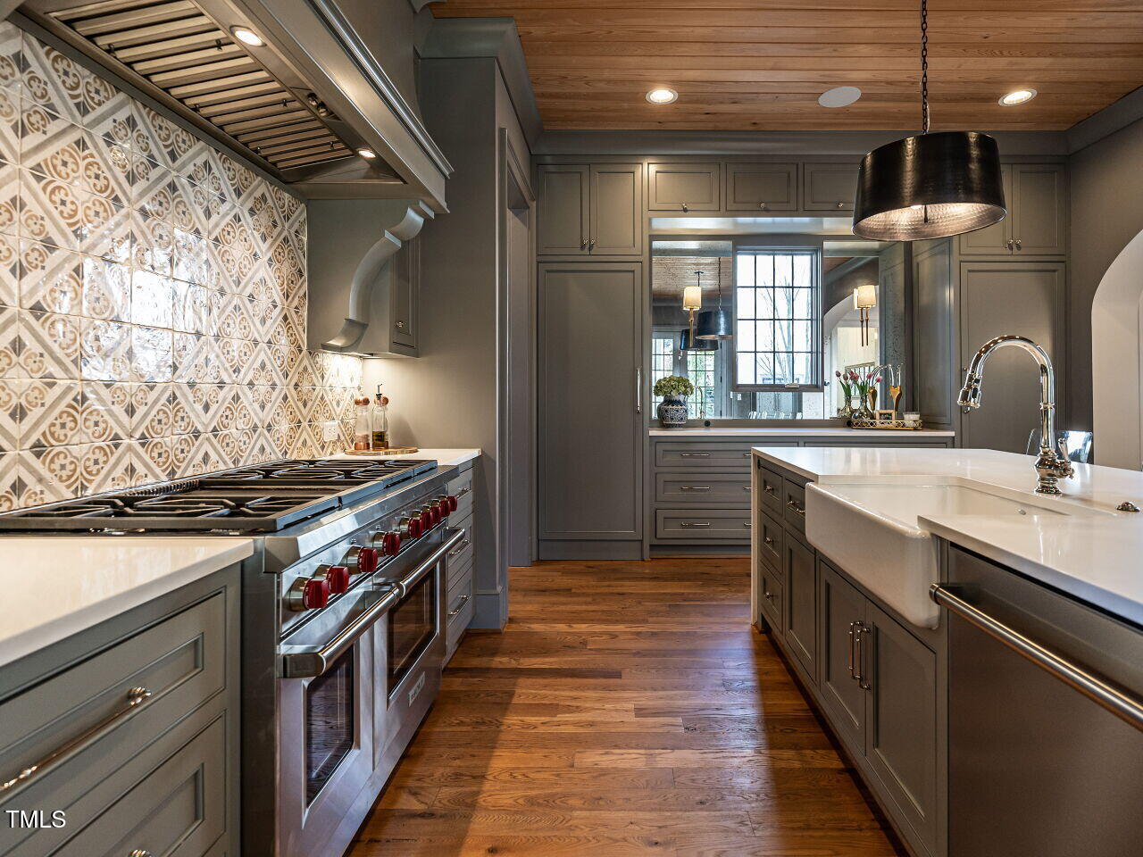 1324 Brooks Avenue Raleigh, NC 27607 - Photo 17 of 65 a kitchen with stainless steel appliances a sink and a stove