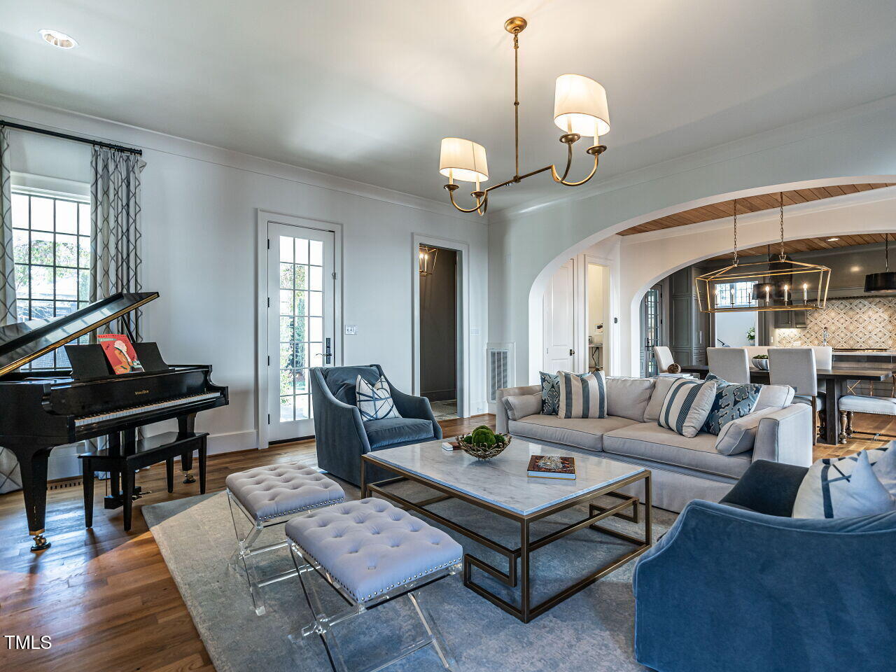 1324 Brooks Avenue Raleigh, NC 27607 - Photo 24 of 65 a living room with furniture a rug and a chandelier