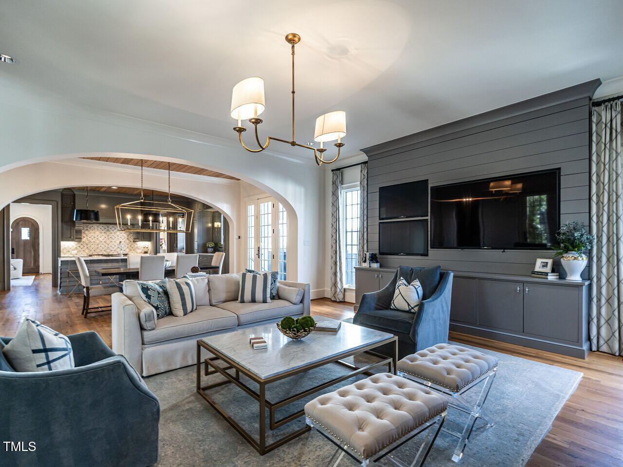 1324 Brooks Avenue Raleigh, NC 27607 - Photo 25 of 65 a living room with furniture a rug and a chandelier