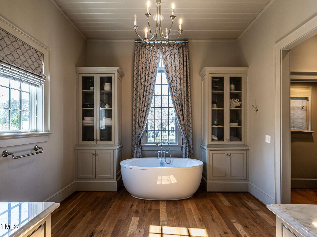 1324 Brooks Avenue Raleigh, NC 27607 - Photo 29 of 65 a view of an empty room with wooden floor and windows
