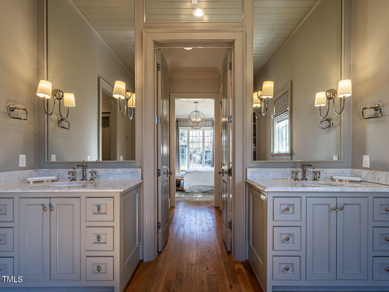 1324 Brooks Avenue Raleigh, NC 27607 - Photo 30 of 65 a spacious bathroom with a granite countertop sink a large mirror a vanity and a