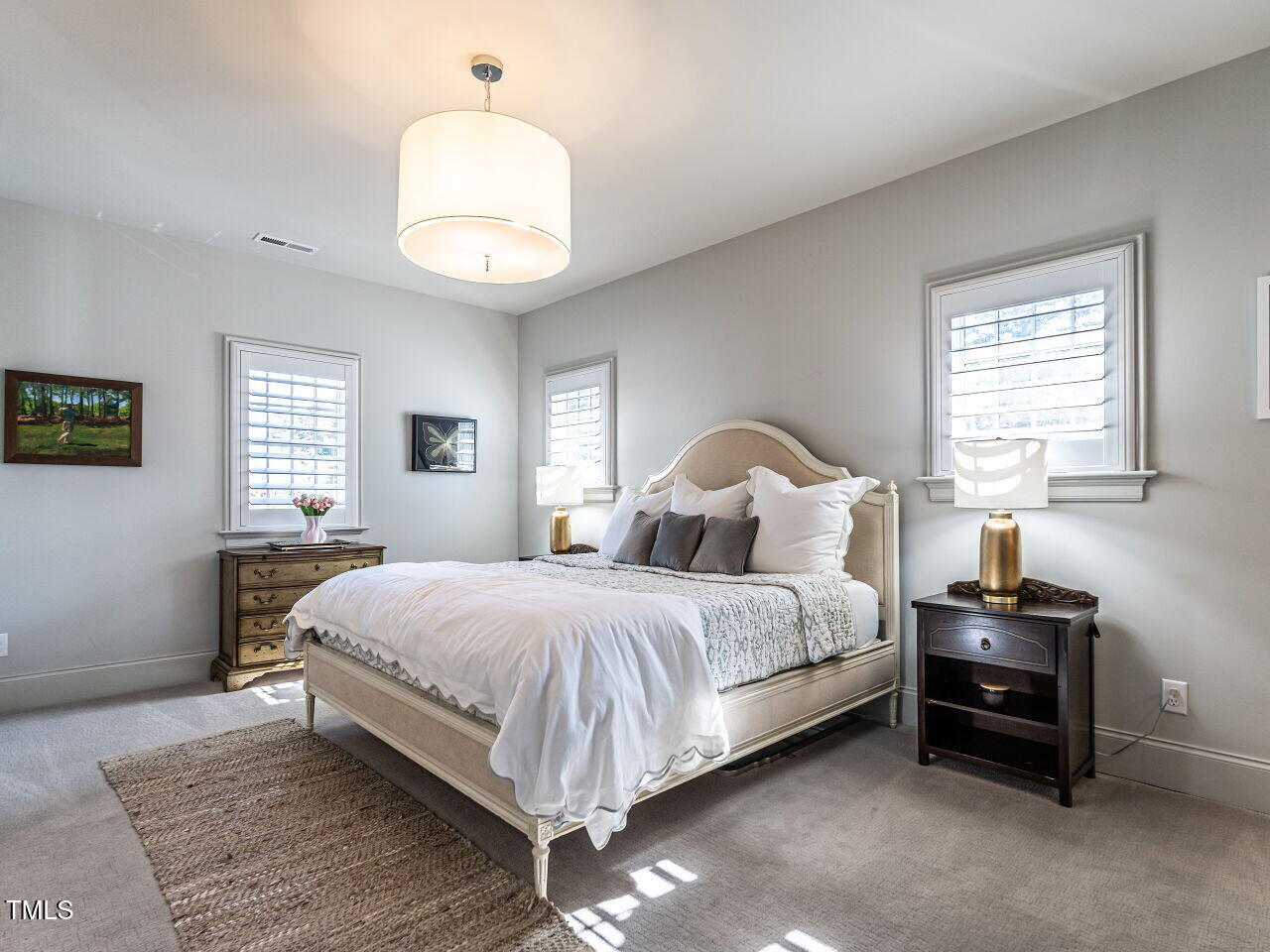 1324 Brooks Avenue Raleigh, NC 27607 - Photo 34 of 65 a bedroom with a bed and a chandelier