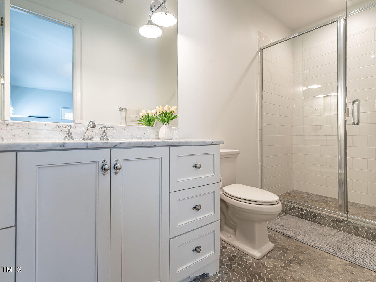 1324 Brooks Avenue Raleigh, NC 27607 - Photo 35 of 65 a bathroom with a sink a toilet and shower