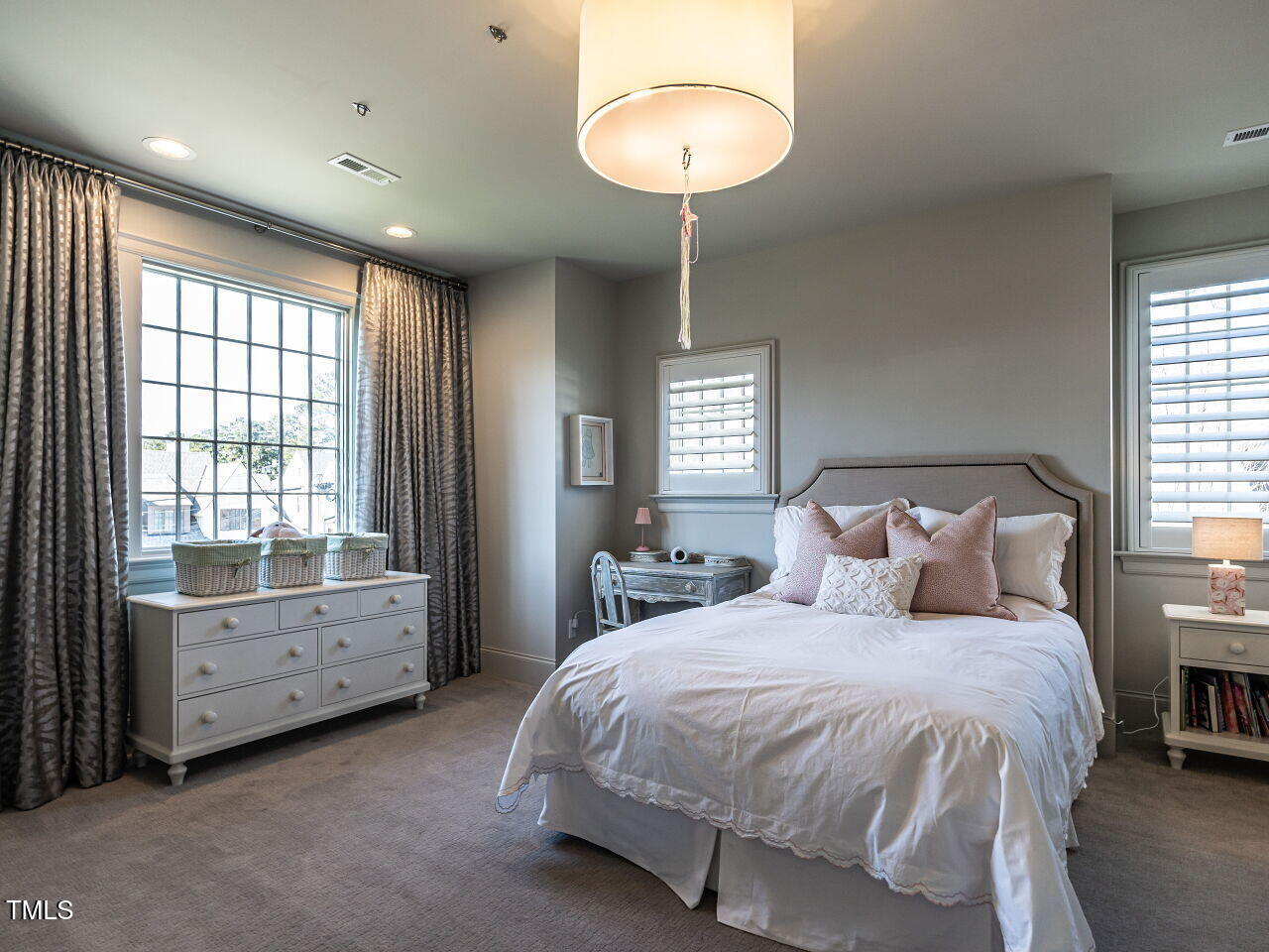1324 Brooks Avenue Raleigh, NC 27607 - Photo 37 of 65 a spacious bedroom with a bed and a chandelier