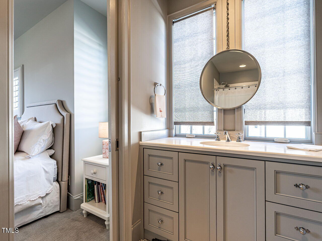 1324 Brooks Avenue Raleigh, NC 27607 - Photo 38 of 65 a bathroom with a double vanity sink and a mirror