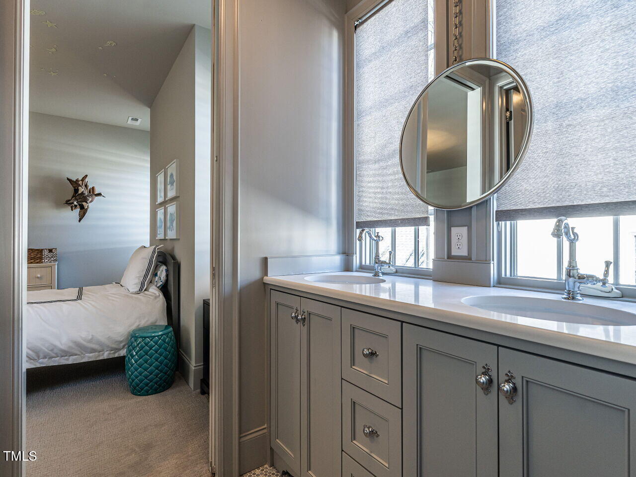 1324 Brooks Avenue Raleigh, NC 27607 - Photo 40 of 65 a en suite bathroom with a double vanity sink and a mirror