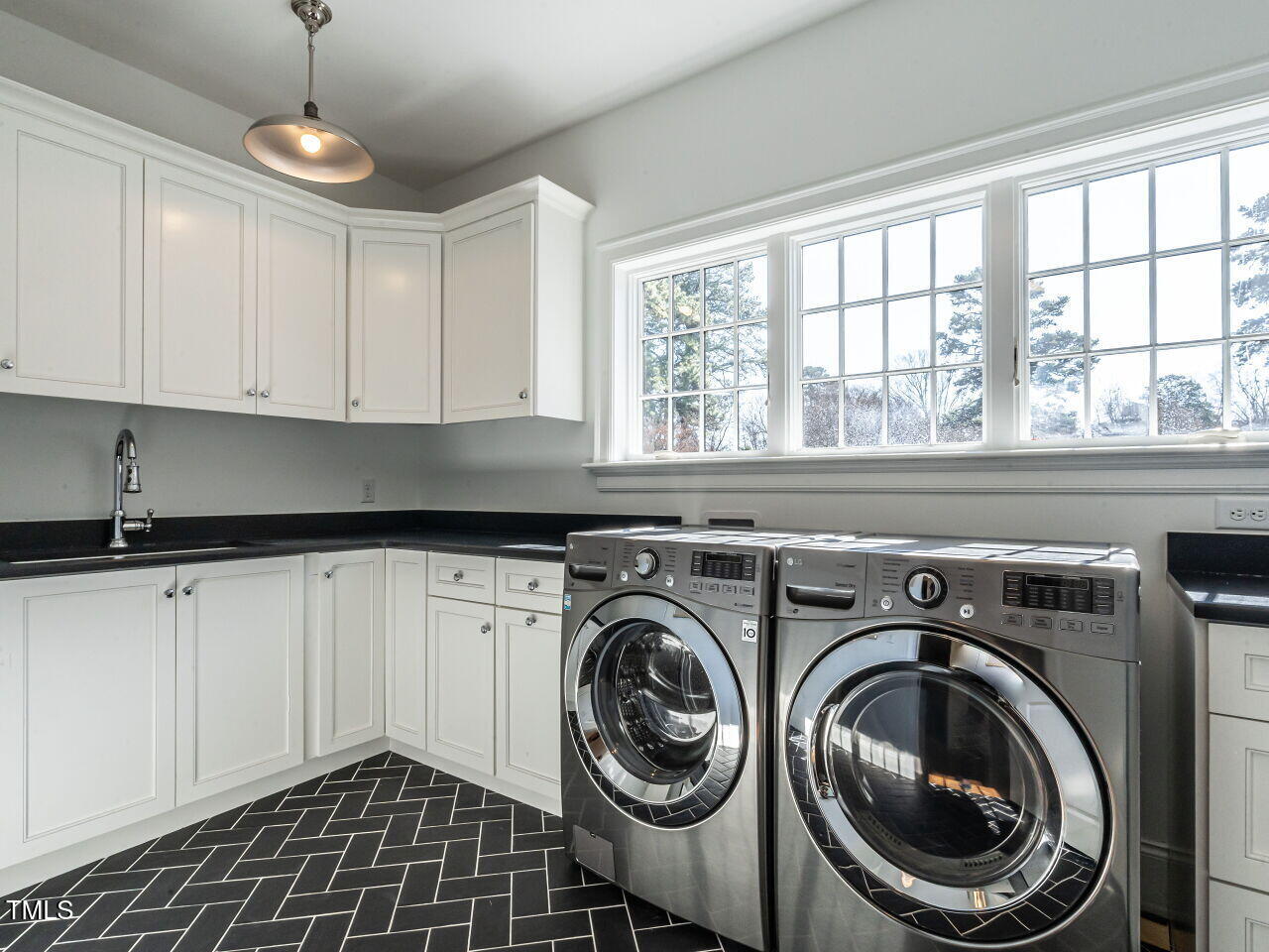 1324 Brooks Avenue Raleigh, NC 27607 - Photo 42 of 65 a utility room with sink dryer and washer