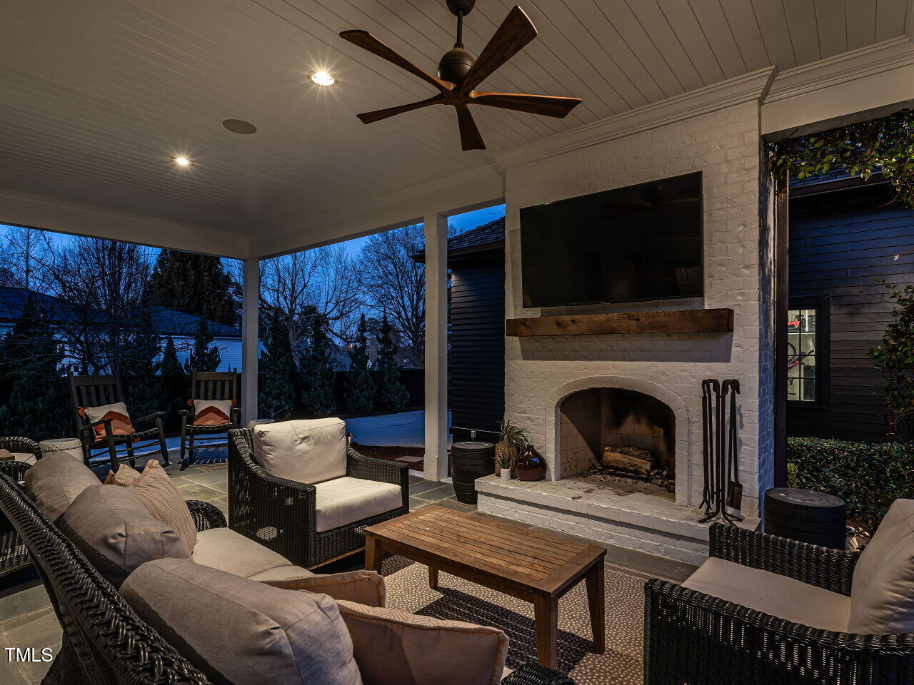 1324 Brooks Avenue Raleigh, NC 27607 - Photo 54 of 65 a living room with furniture a flat screen tv and a fireplace