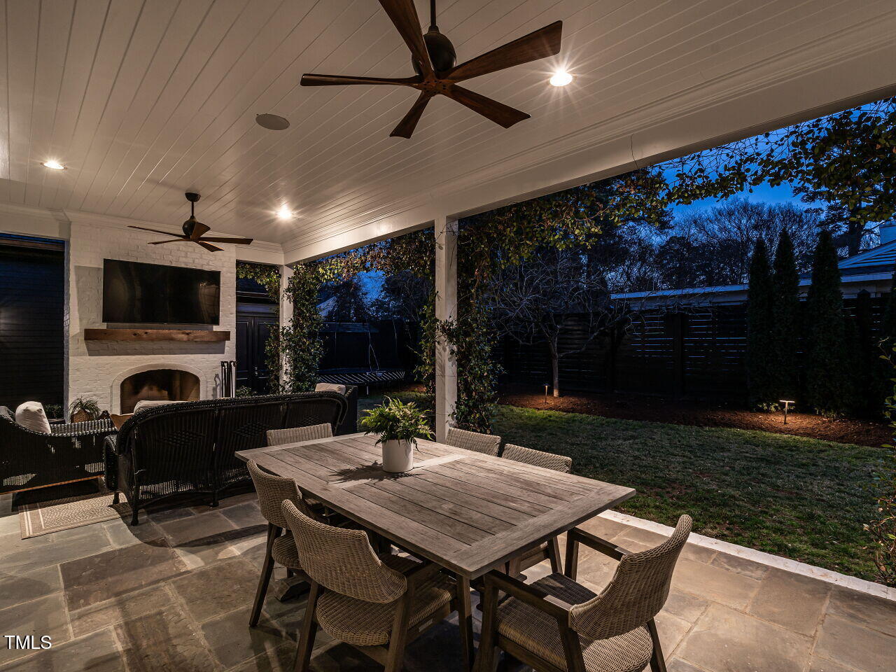 1324 Brooks Avenue Raleigh, NC 27607 - Photo 57 of 65 a view of a patio with a dining table and chairs