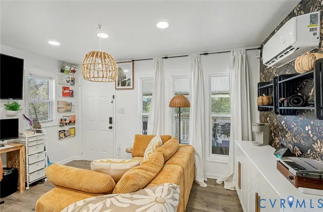 a kitchen with stainless steel appliances kitchen island granite countertop a refrigerator and a sink