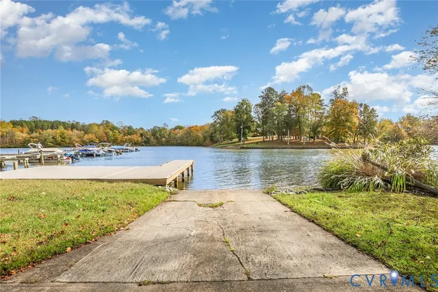 a view of a lake with houses in the back