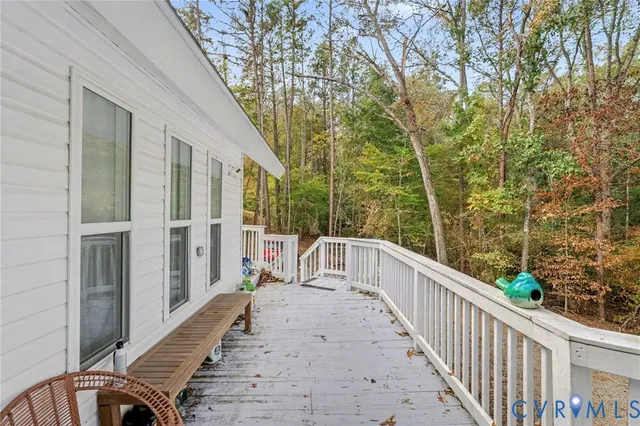 a view of a balcony with wooden floor