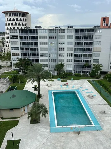 a view of a swimming pool and a fire pit
