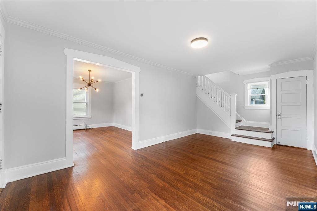 177 East Pierrepont Avenue Rutherford, NJ 07070 - Photo 5 of 27 an empty room with wooden floor and windows