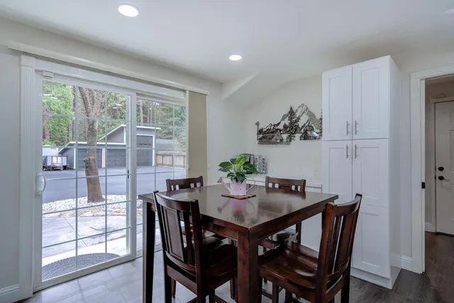 a view of a dining room with furniture window and outside view