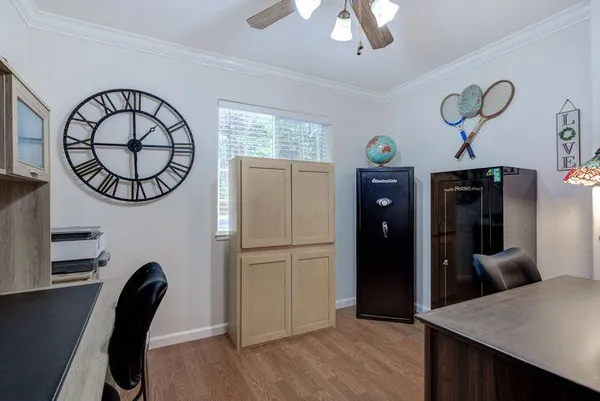 a view of a hallway with seating area and entryway