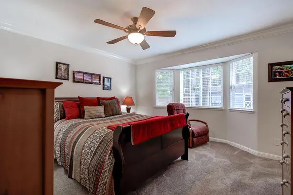 a bed room with a bed and a window