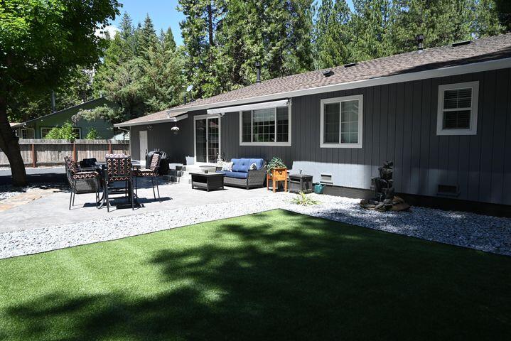 37105 Sapphire Road Burney, CA 96013 - Photo 37 of 39 a view of backyard of house with outdoor seating and green space