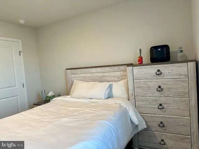 a bedroom with a bed and a closet