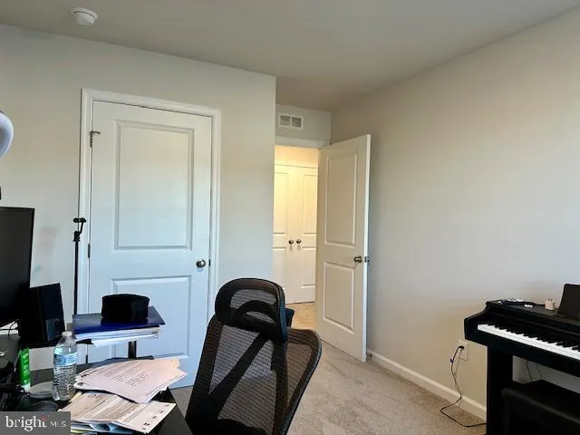 a bathroom with a sink shower and a mirror