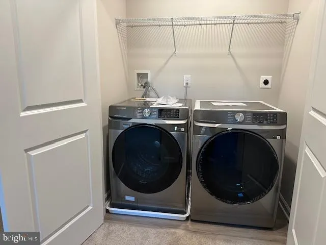 a view of a house with a yard and a large window