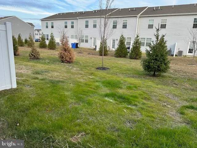a view of a back yard of the house