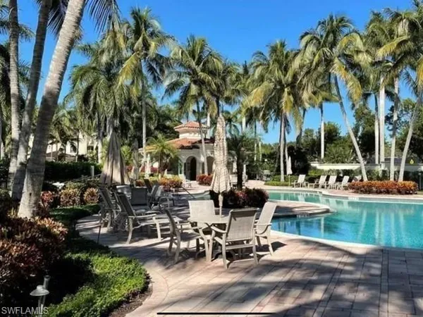 a view of a swimming pool with chairs