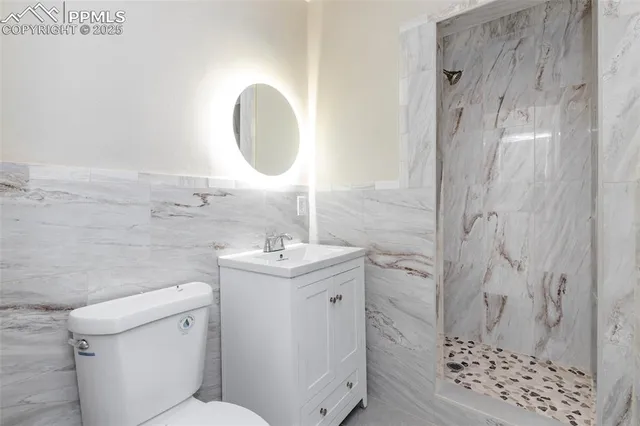 a view of an empty room with a fireplace