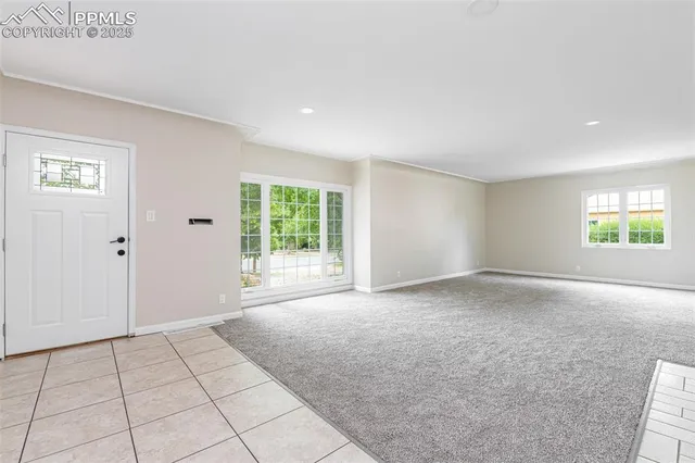 an empty room with a empty space and window