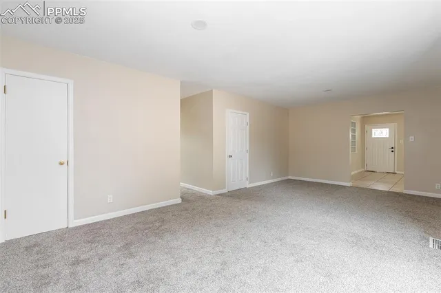 a kitchen with granite countertop cabinets stainless steel appliances and a sink