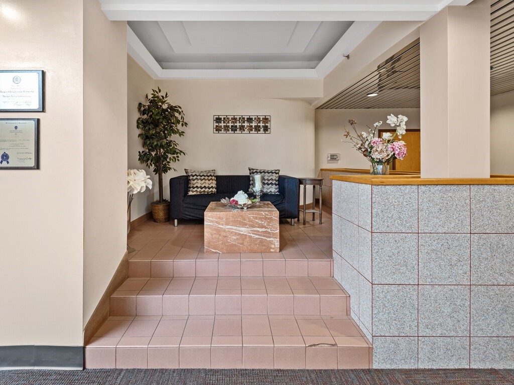 10 Linwood Street, Unit 214 Malden, MA 02148 - Photo 18 of 37 a living room with furniture and flowers