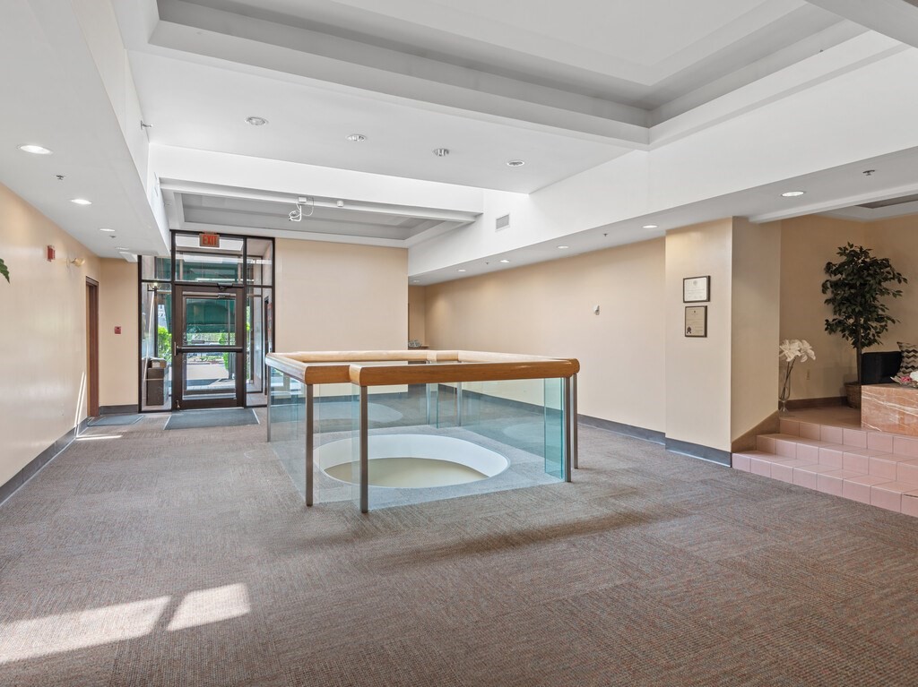 10 Linwood Street, Unit 214 Malden, MA 02148 - Photo 19 of 37 a view of a hallway with furniture