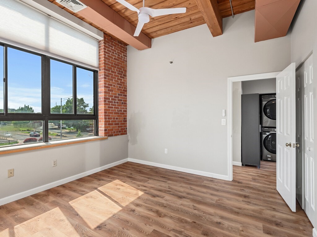 10 Linwood Street, Unit 214 Malden, MA 02148 - Photo 2 of 37 a view of empty room with wooden floor and fan