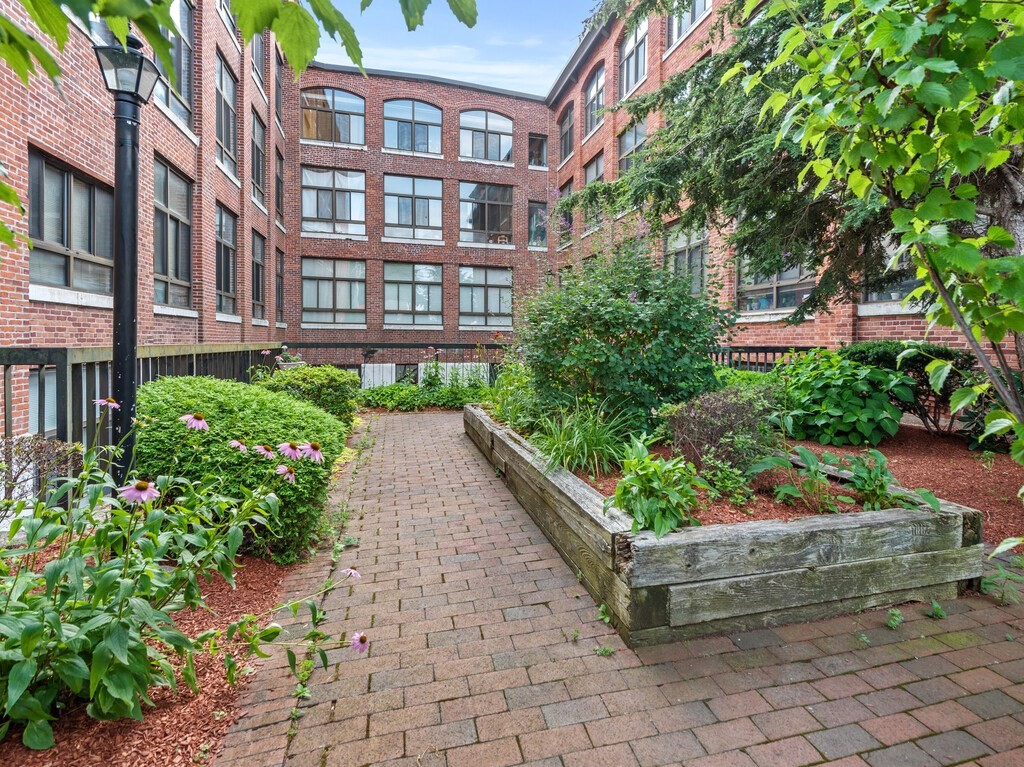 10 Linwood Street, Unit 214 Malden, MA 02148 - Photo 23 of 37 a view of a garden with pathway