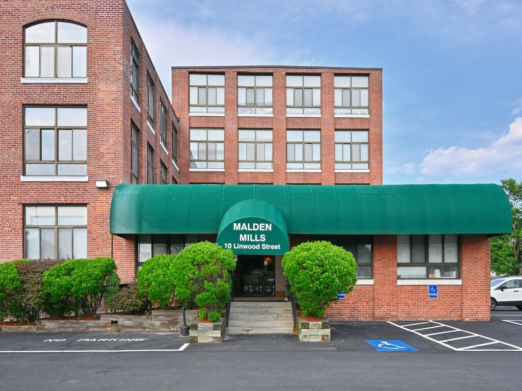 10 Linwood Street, Unit 214 Malden, MA 02148 - Photo 29 of 37 a front view of a building and garage