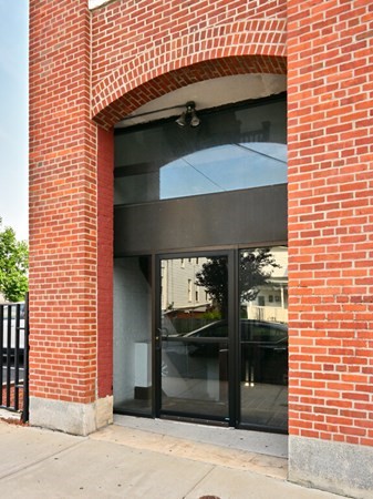 10 Linwood Street, Unit 214 Malden, MA 02148 - Photo 32 of 37 a closeup of a building with glass door