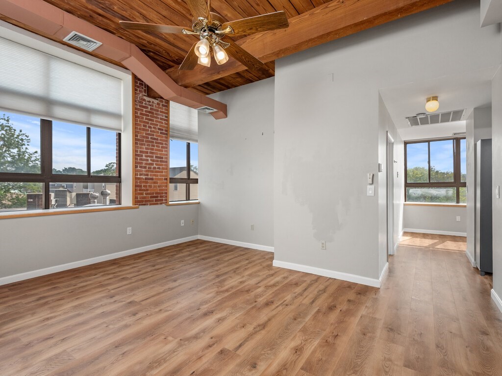 10 Linwood Street, Unit 214 Malden, MA 02148 - Photo 7 of 37 wooden floor in an empty room with a window